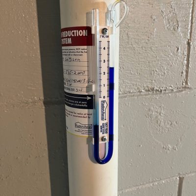 Detailed shot of radon gas monitor showing safe levels