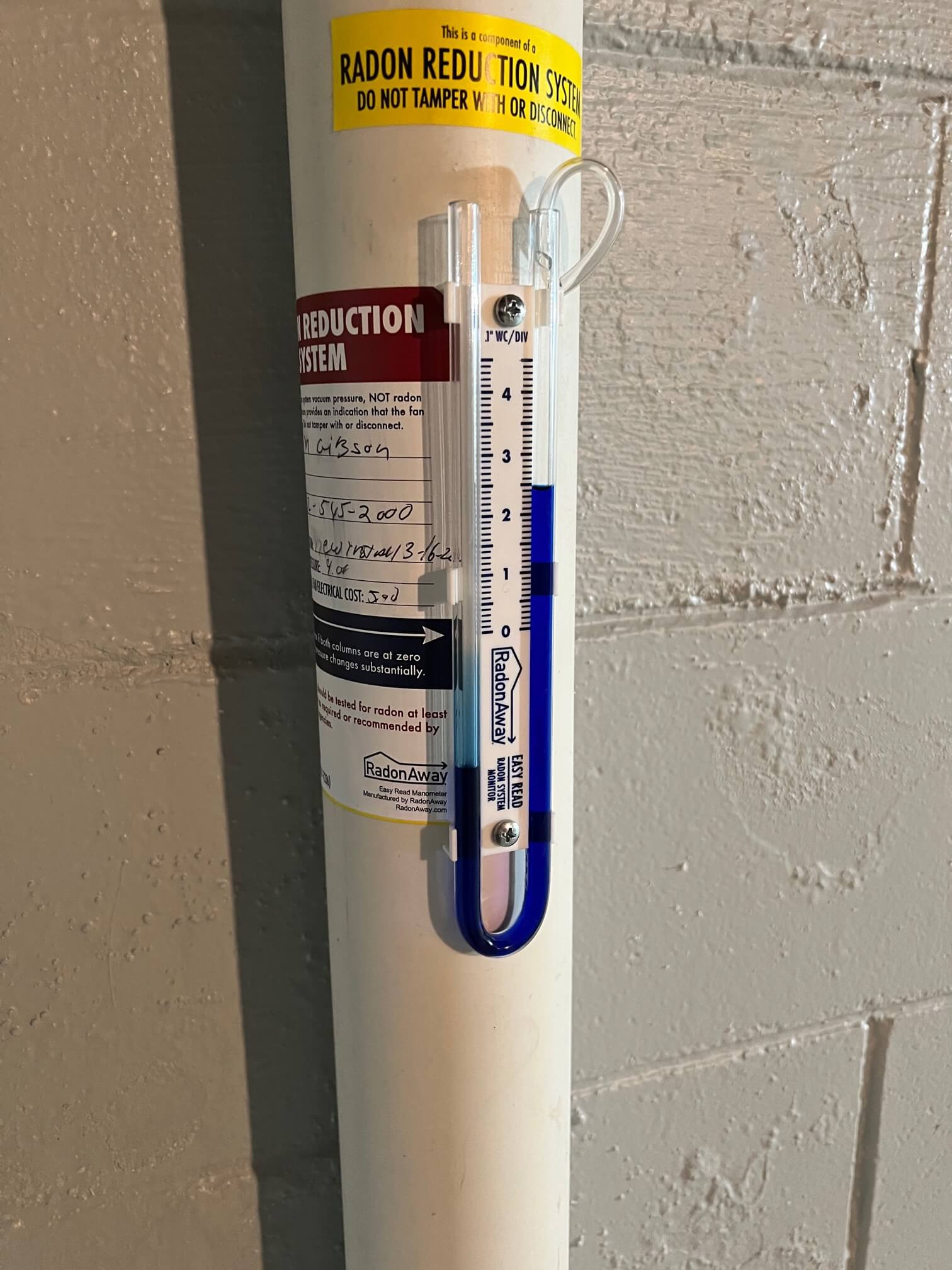 Detailed shot of radon gas monitor showing safe levels