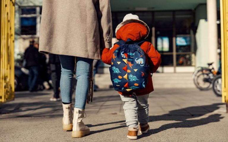 A parent and child walk into a daycare. Radon mitigation systems in daycares help protect the most vulnerable.